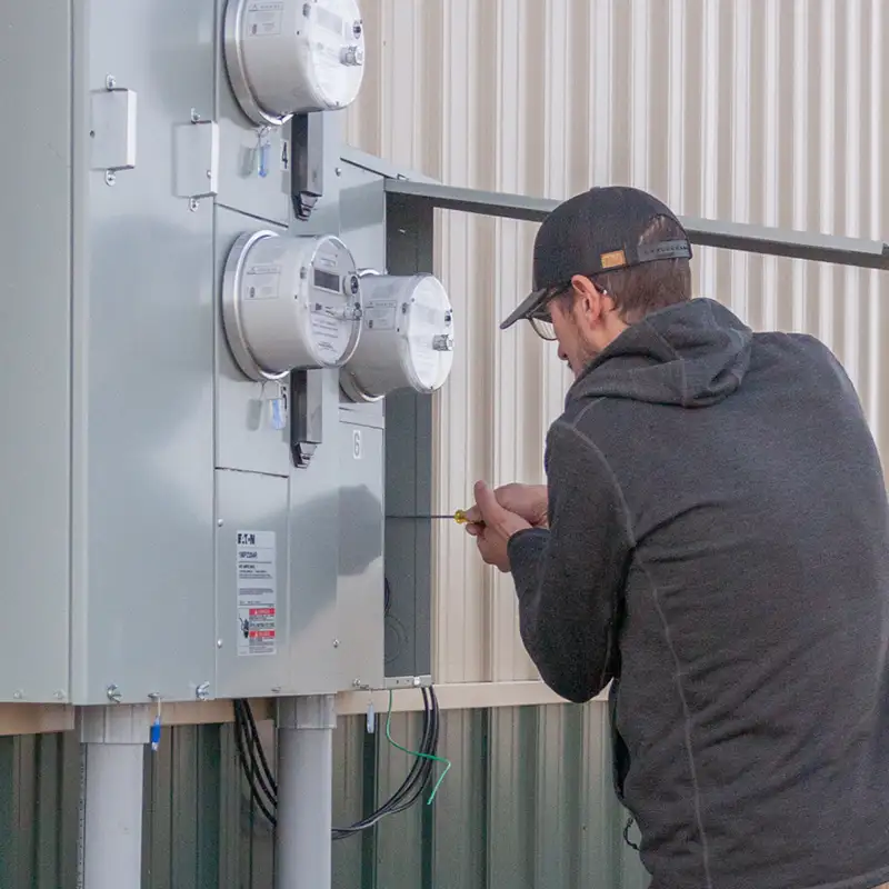 Electrician in Billings MT working on electrical commercial panel